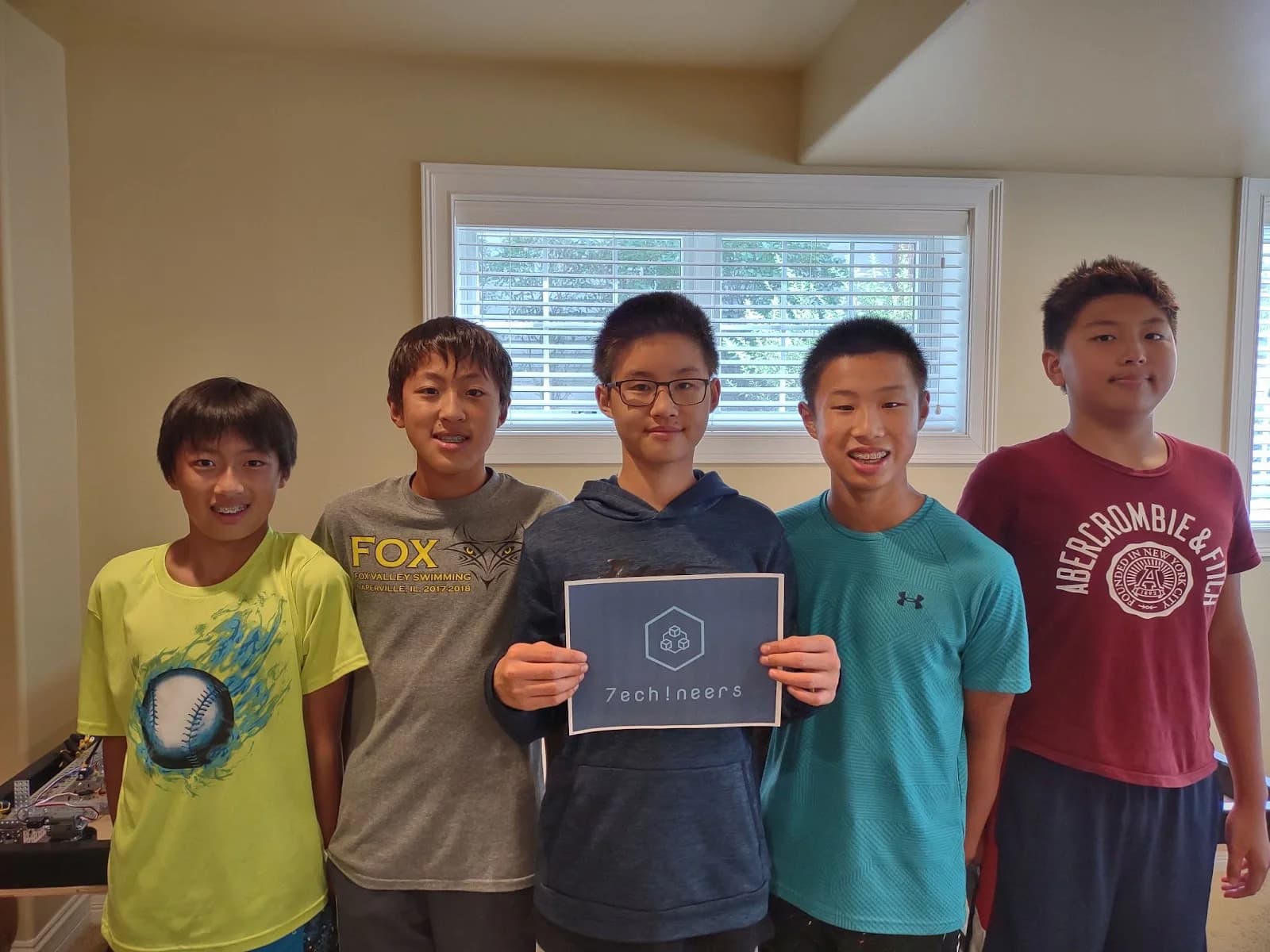 The 2021-22 founding class holding a Techineers sign