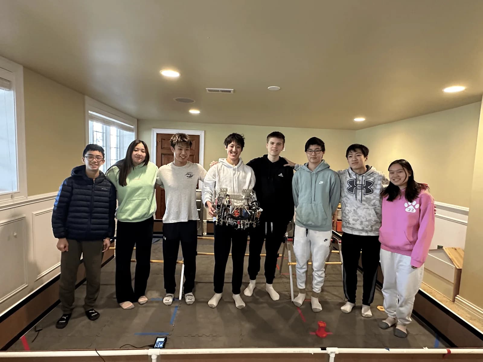 The 2023-24 Techineers standing together in a room
