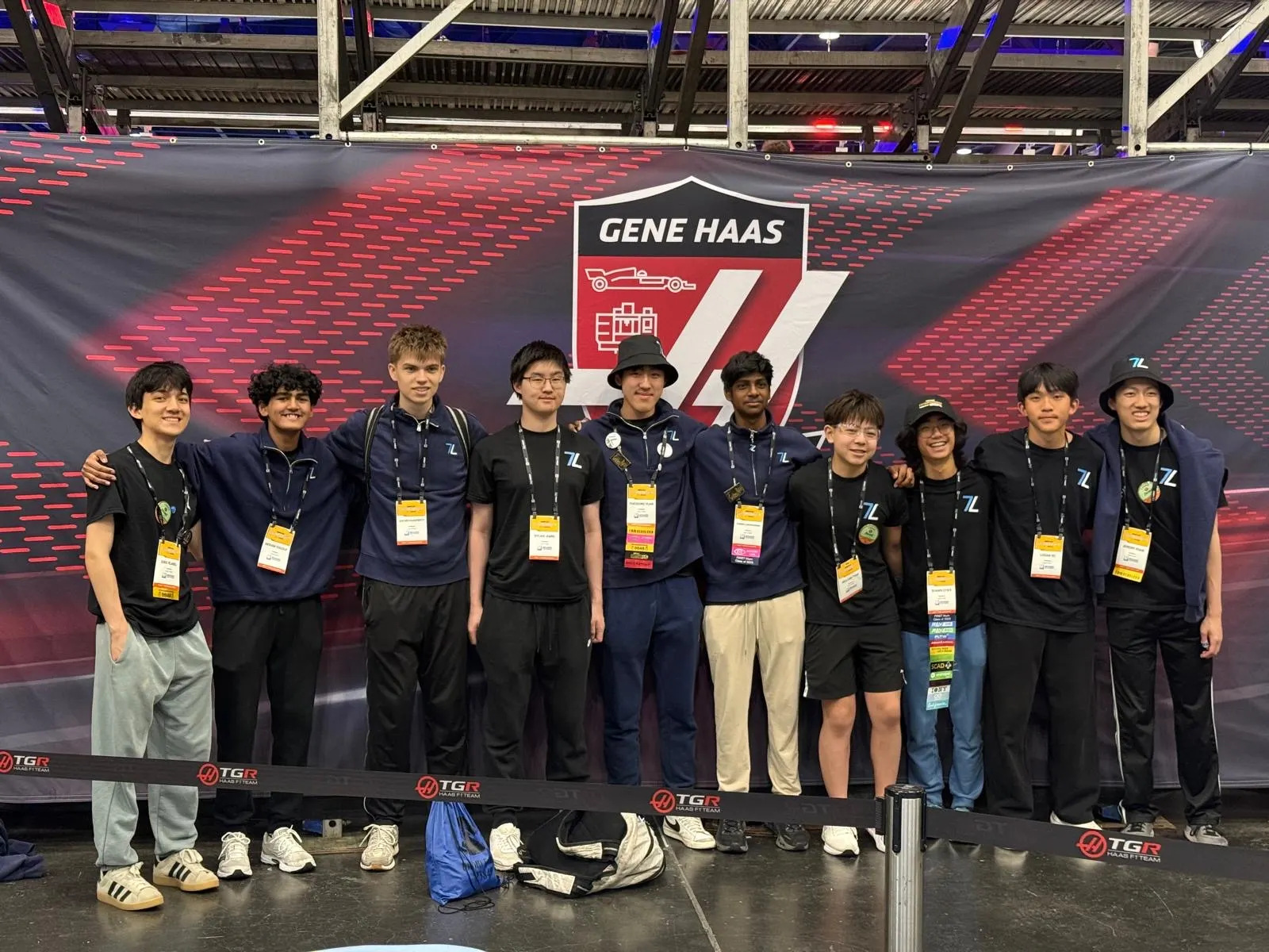 The Techineers lined up in front of the Gene Haas Foundation banner at the FIRST Championship